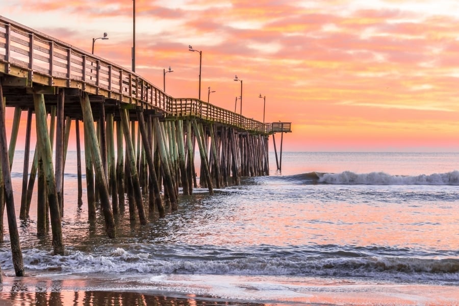 sunset over pier and ocean on Virginia Beach