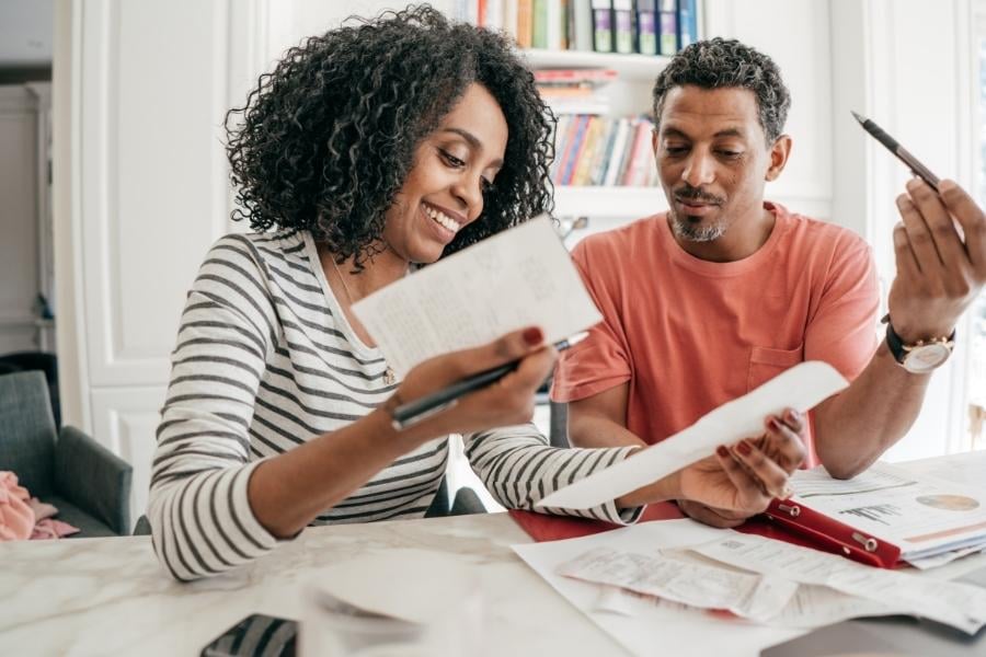 military couple looking at financial papers