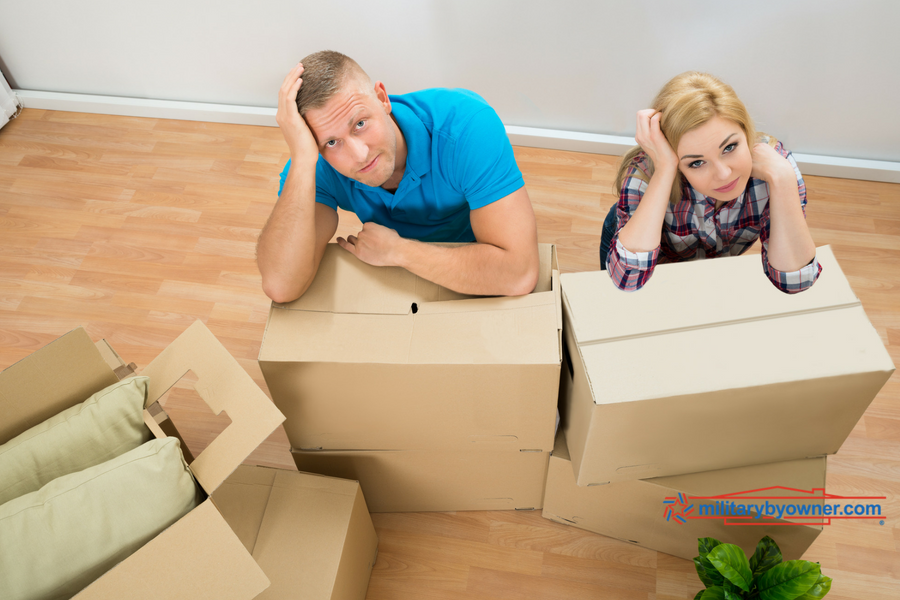 Military couple with moving boxes