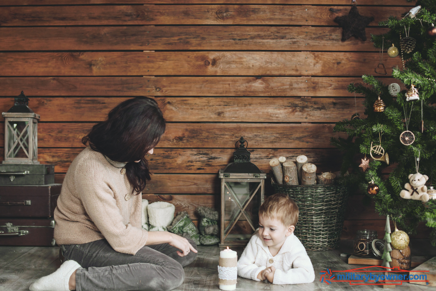 mother and son with Christmas candles