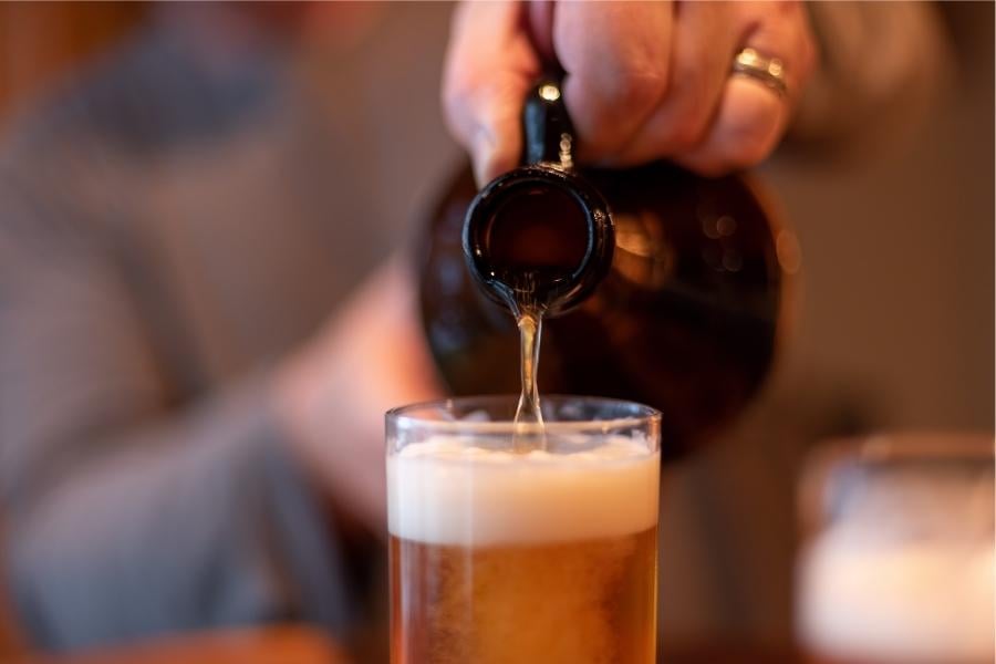 Growler pouring craft beer