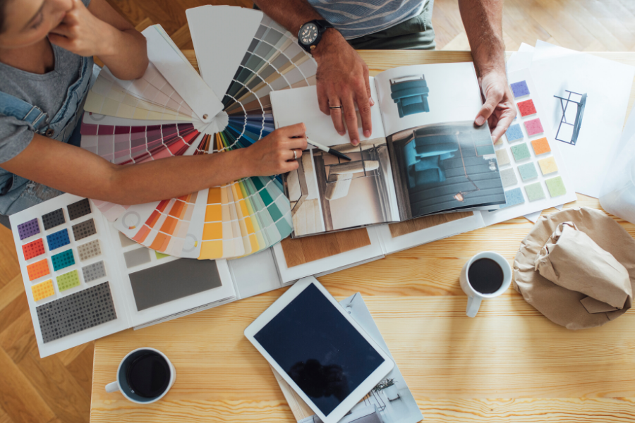 Couple looking at paint samples for home renovation