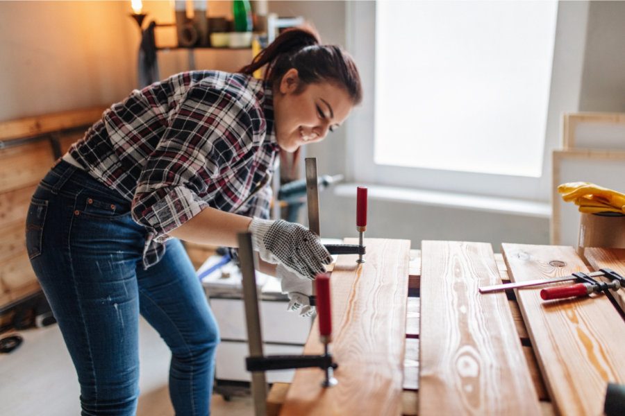 Woman doing woodworking and home renovation