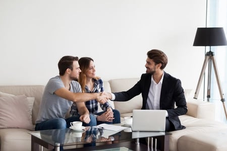 landlord shaking hands with tenants