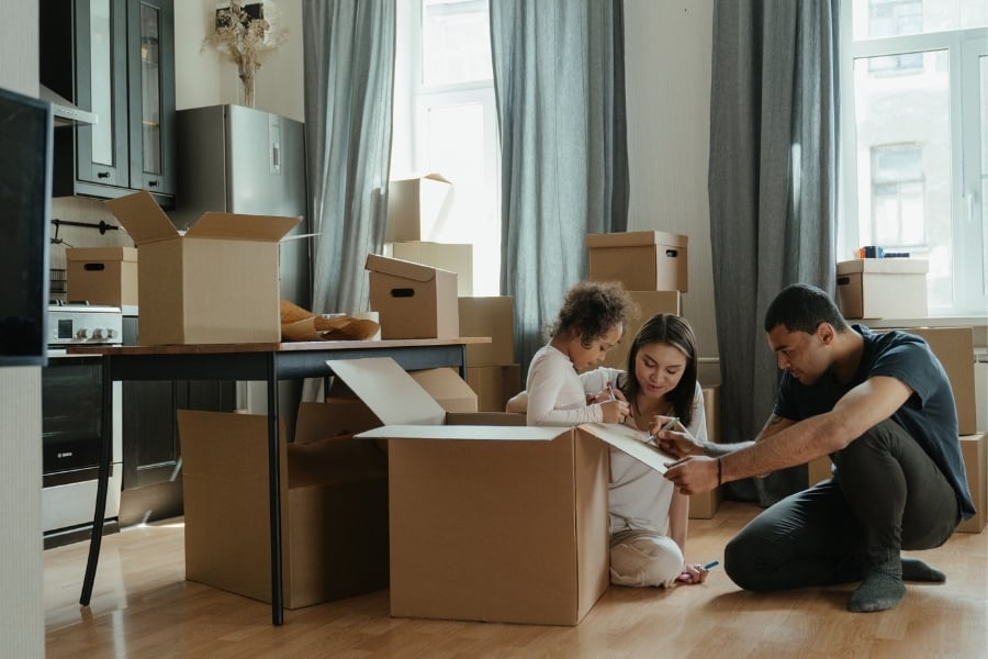 family with moving boxes