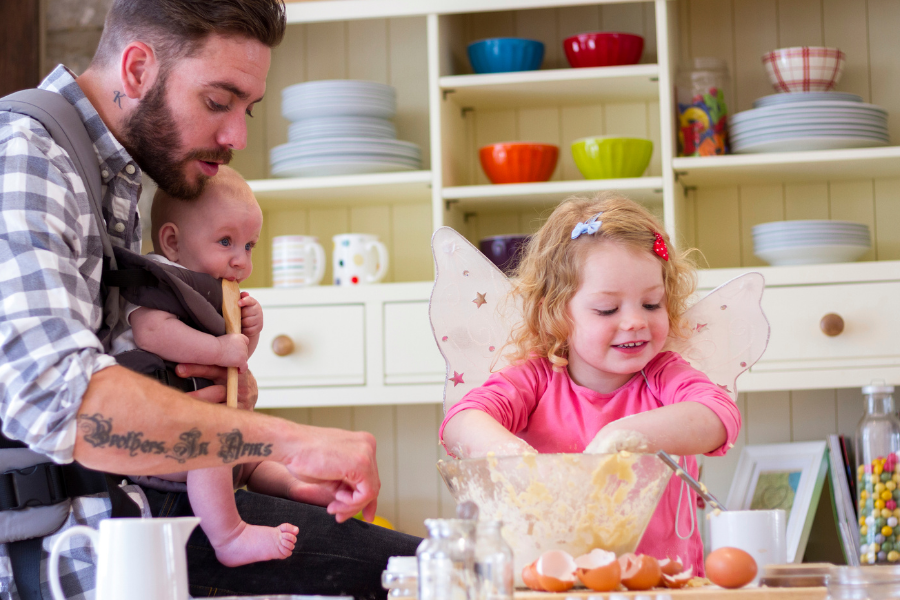 dad baking with baby and toddler