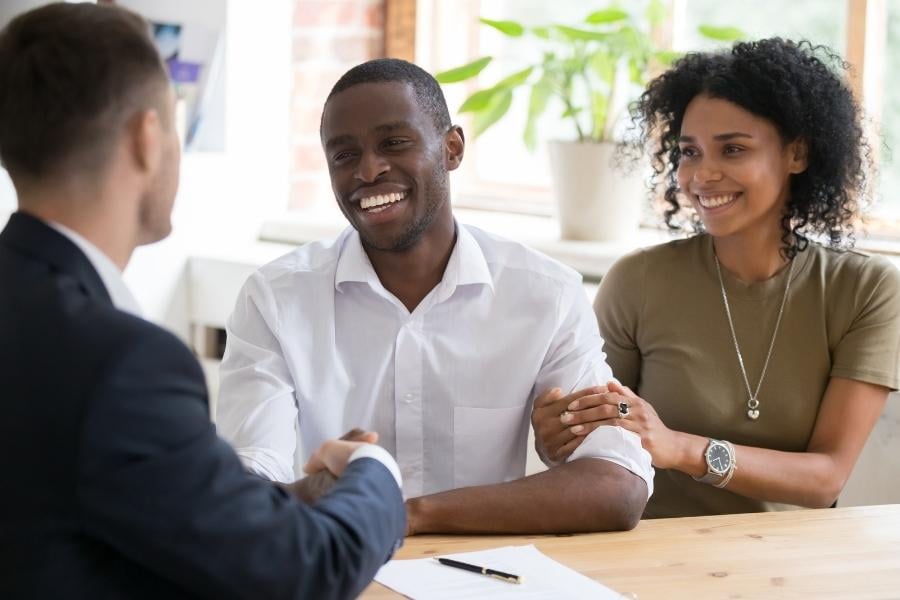 couple speaking with insurance agent