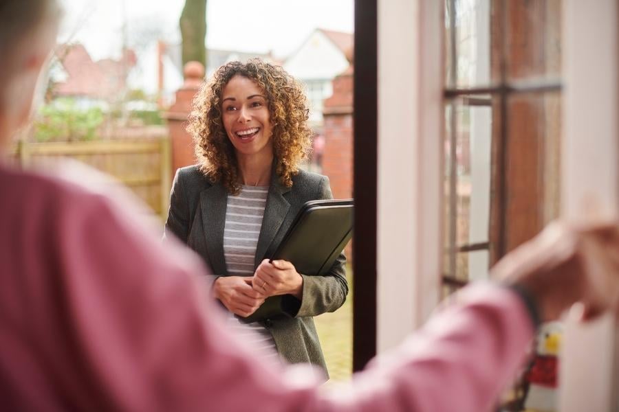 landlord at door talking to tenant