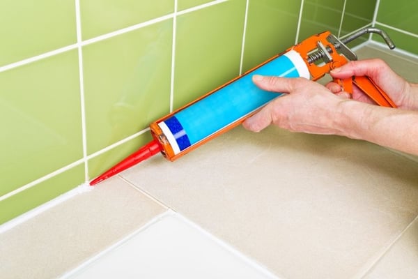 Coordinate with your landlord about repairing bathroom caulking. 