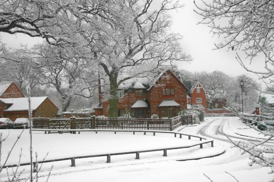 snowy sidewalk streeta and homes