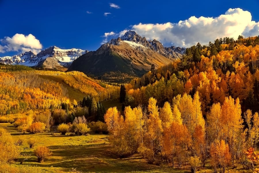 Mountains, valley, blue sky and Fall foliage in Colorado