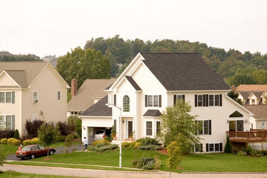 Large white home in neighborhood. 