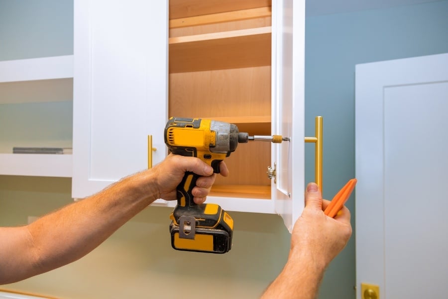 replacing cabinet hardware with drill