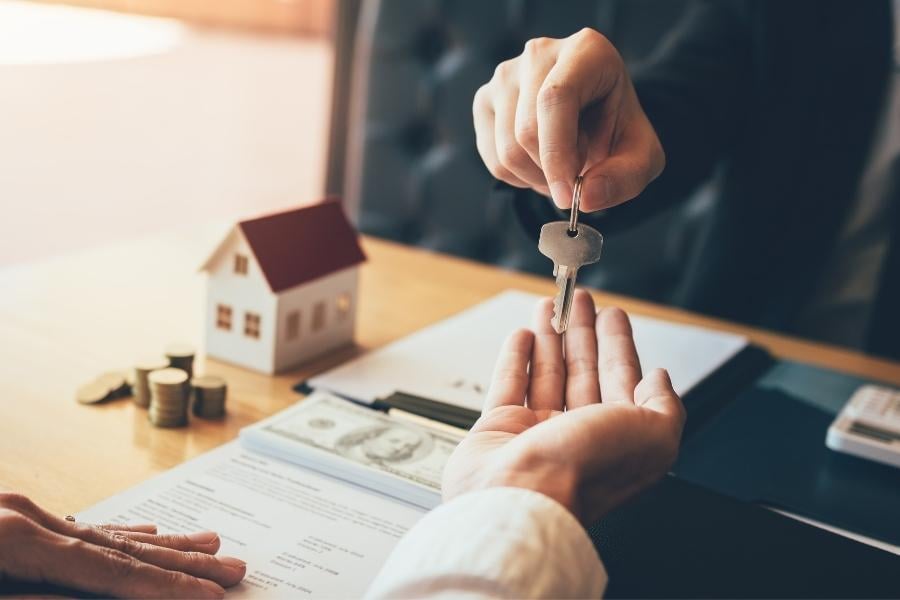 handing keys to homeowner on closing day