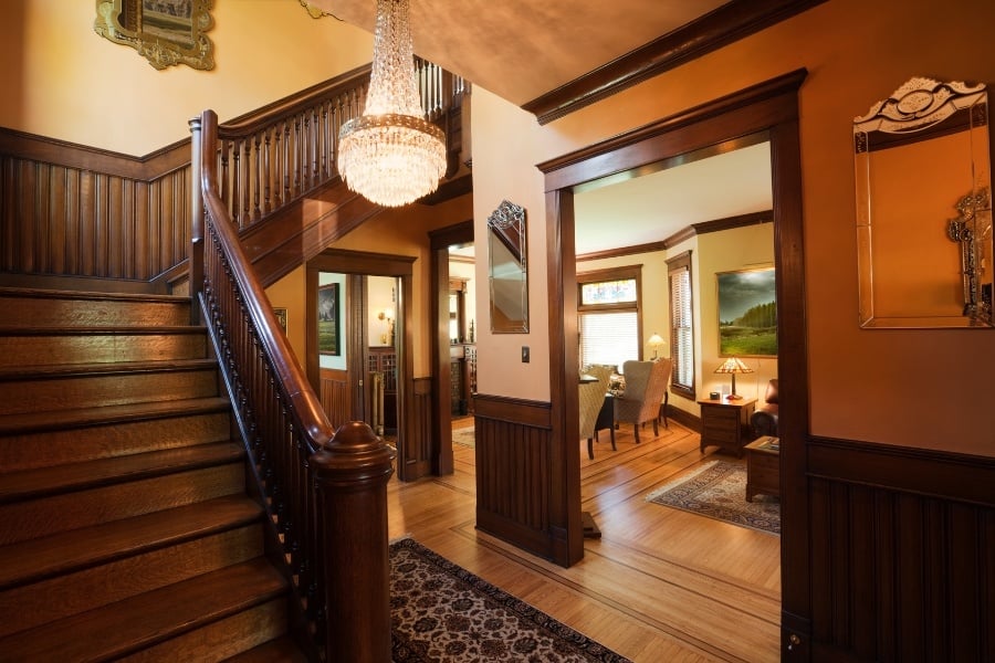 Interior of historic Victorian home with wood trim, paneling, and floors. 