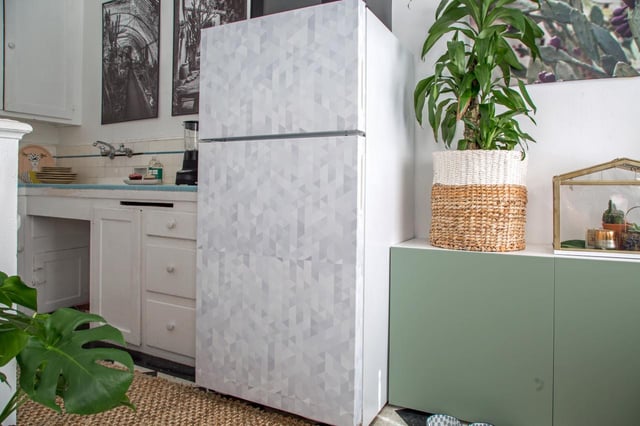 Cover an ugly refrigerator door with patterned wallpaper. 