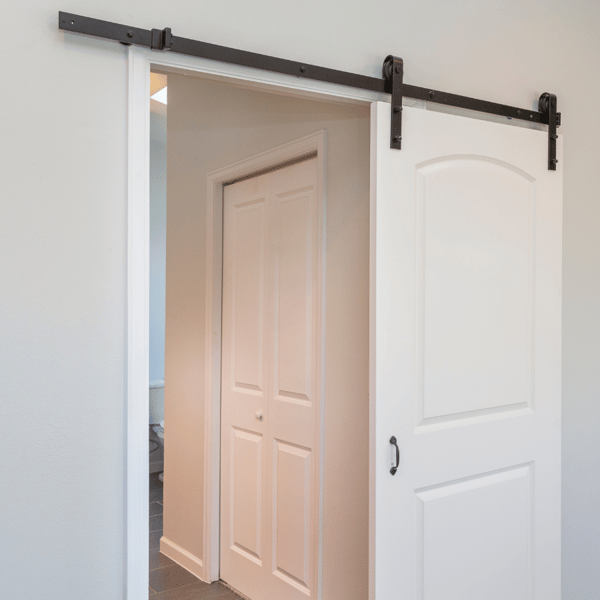 Transform your pre-existing door into a barn door.