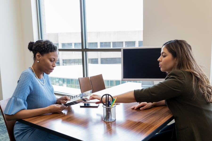 Woman meeting at bank to look over second mortgage options