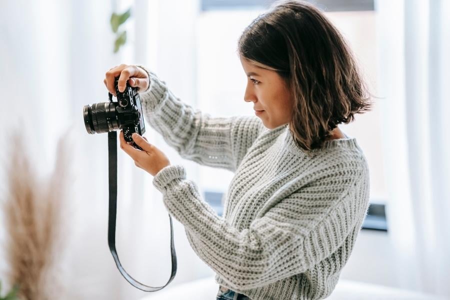 woman taking real estate photos