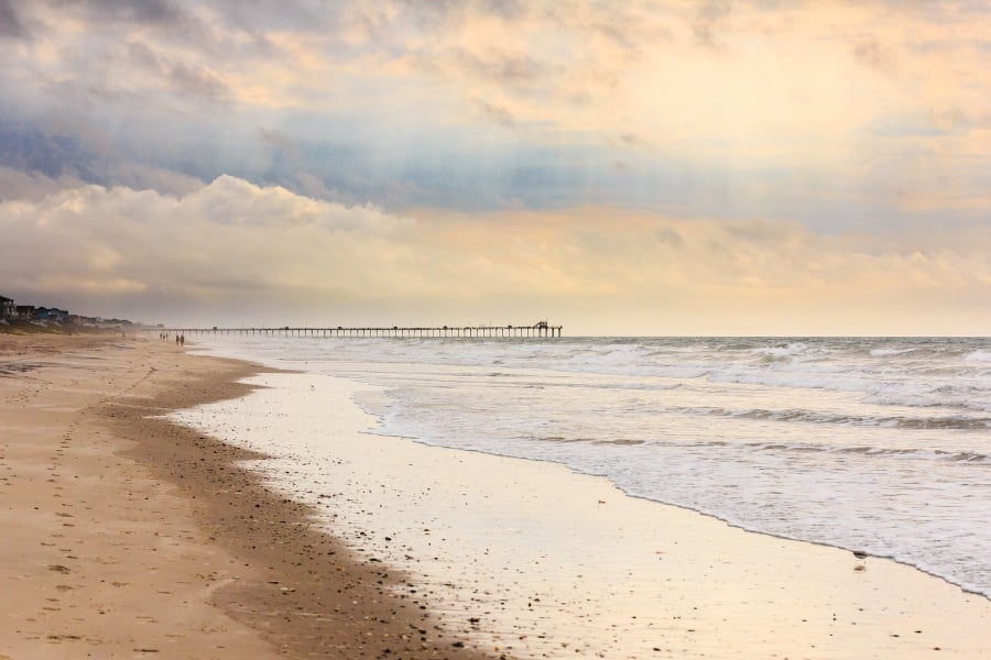 Photo of long stretch of beach and pier at Emerald Isle, North Carolina 