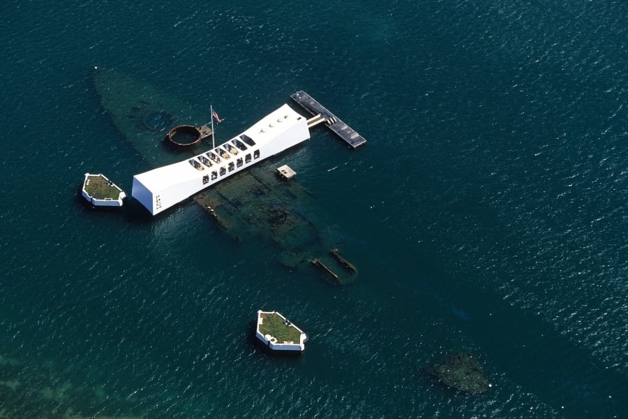 aerial view of the USS Arizona in dark water at Pearl Harbor Hawaii