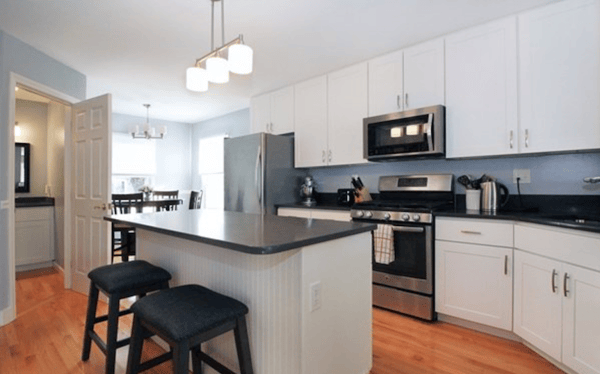 Updated white kitchen in Rhode Island rental home. 