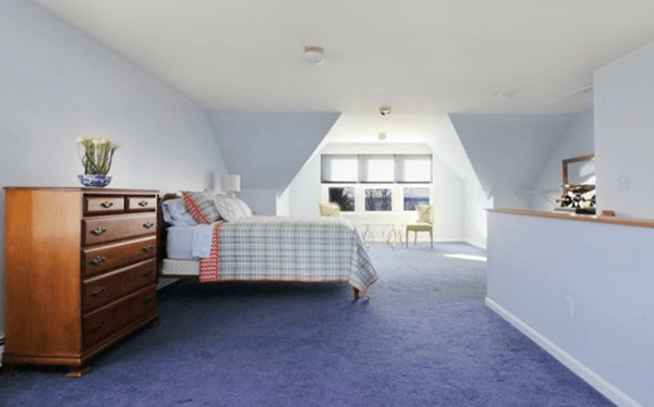 Third floor loft style bedroom in fully furnished Newport rental home. 