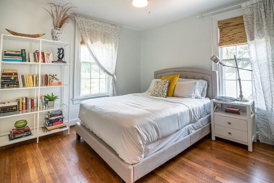 bedroom with curtains and two walls