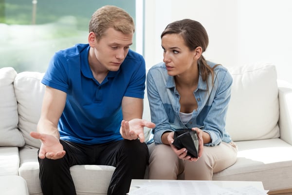 Horizontal view of couple having empty wallet