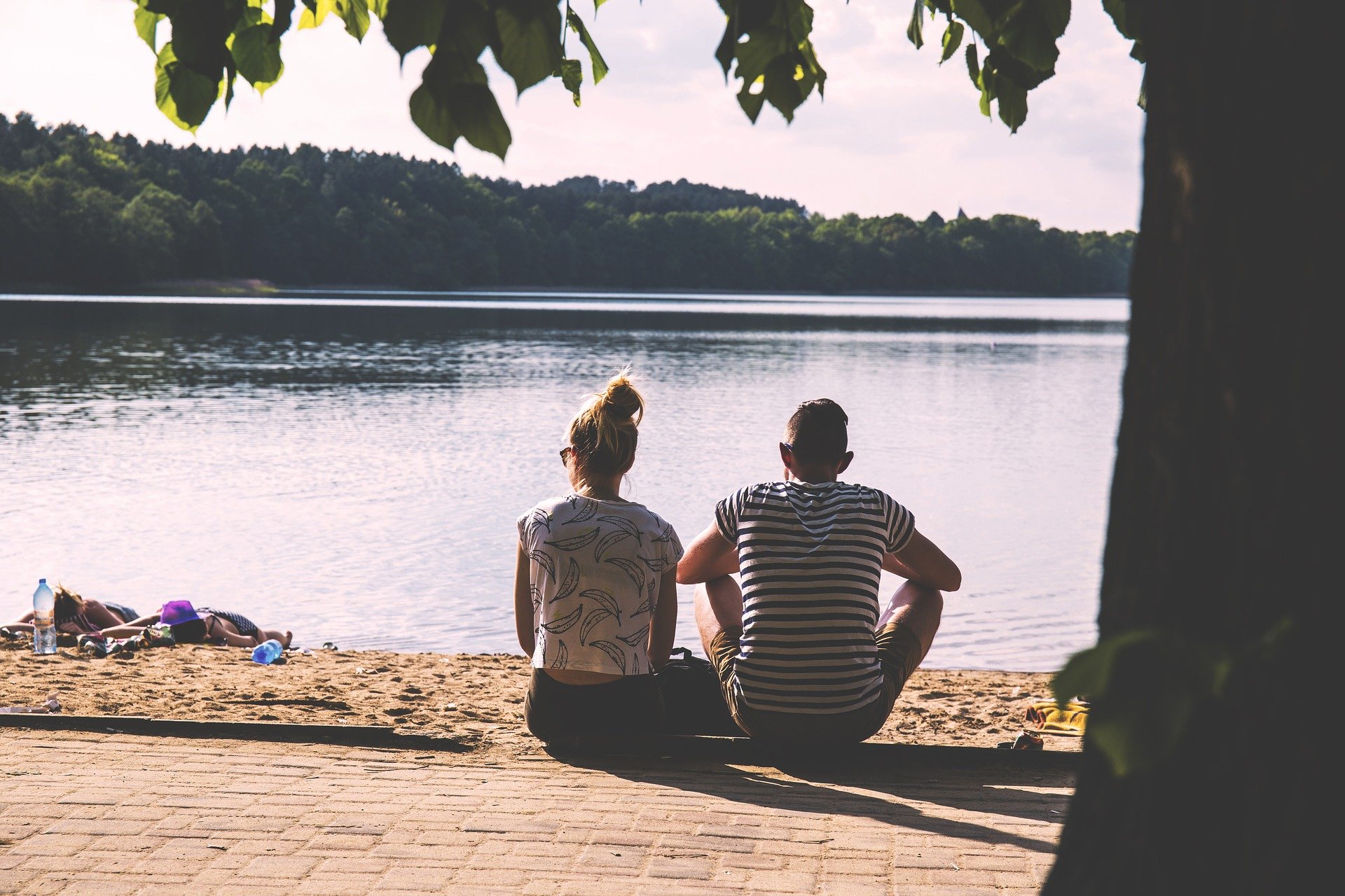 Couple sitting at lake vacation home