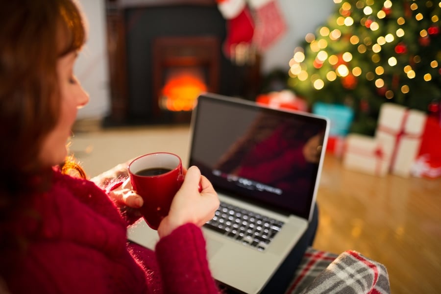 woman with cup of coffee and laptop 