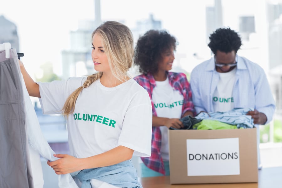 Volunteers loading boxes with clothing