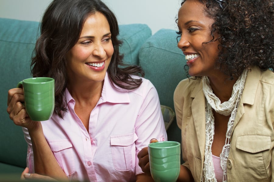 military spouses sharing cup of coffee 