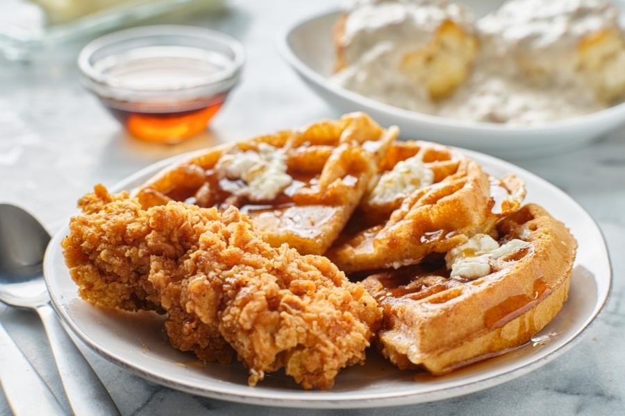 Chicken and waffles on white plate