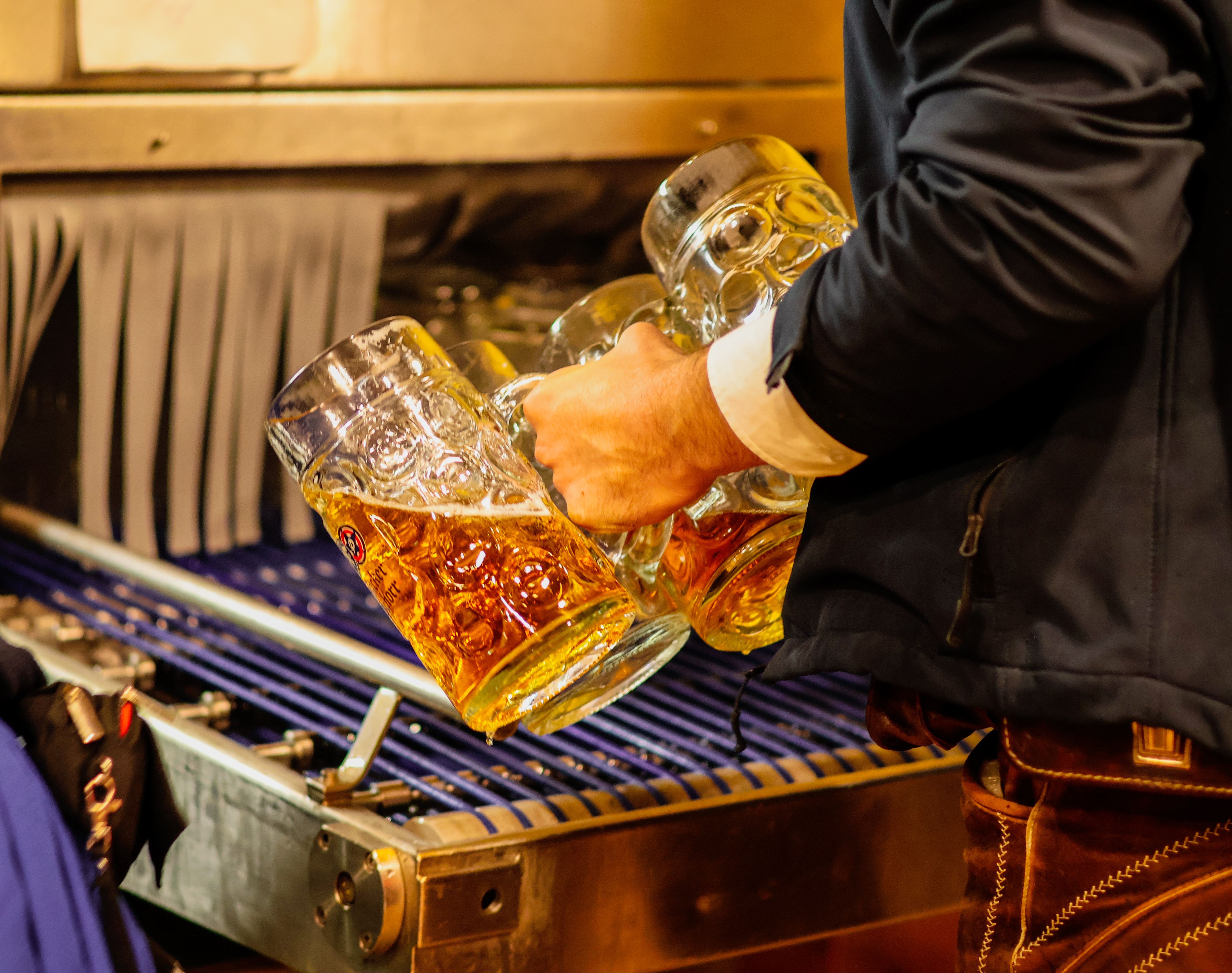 holding beer steins at Munich Oktoberfest