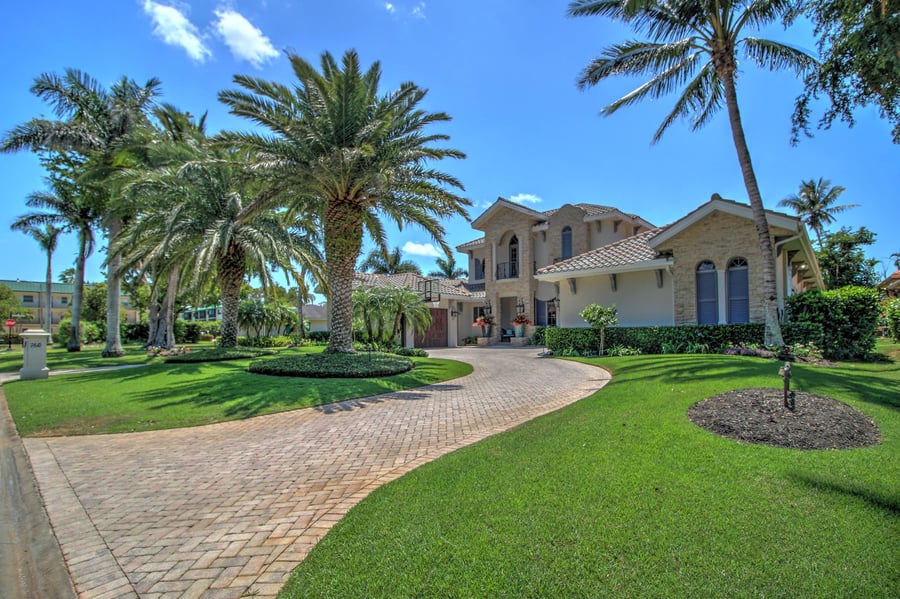 real estate photo of beautiful home exterior and driveway