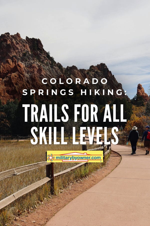 Man and Woman walking paved trail in Garden of the Gods State Park with text, Colorado Springs Hiking Trails for All Skill Levels