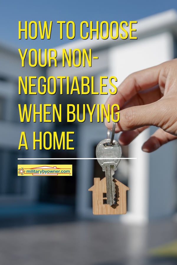 Person holding keys with wooden house key ring with text, How to Choose Your Non-Negotiables When Buying a Home