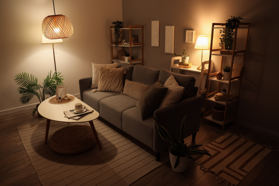 Photo of dark neutral living room with ambient lighting. 