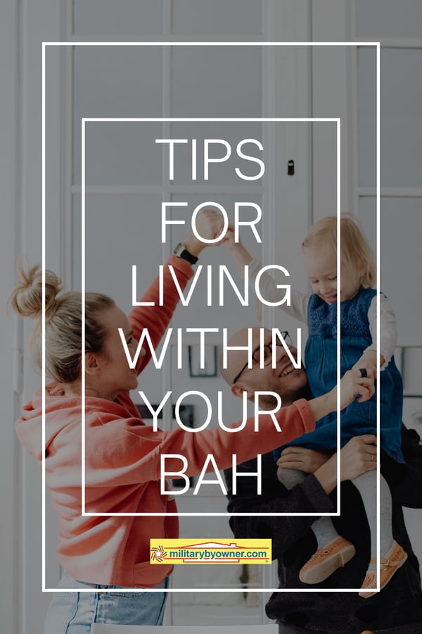 Mom and dad hold and play with little girl in their arms with text, Tips for Living Within Your BAH 