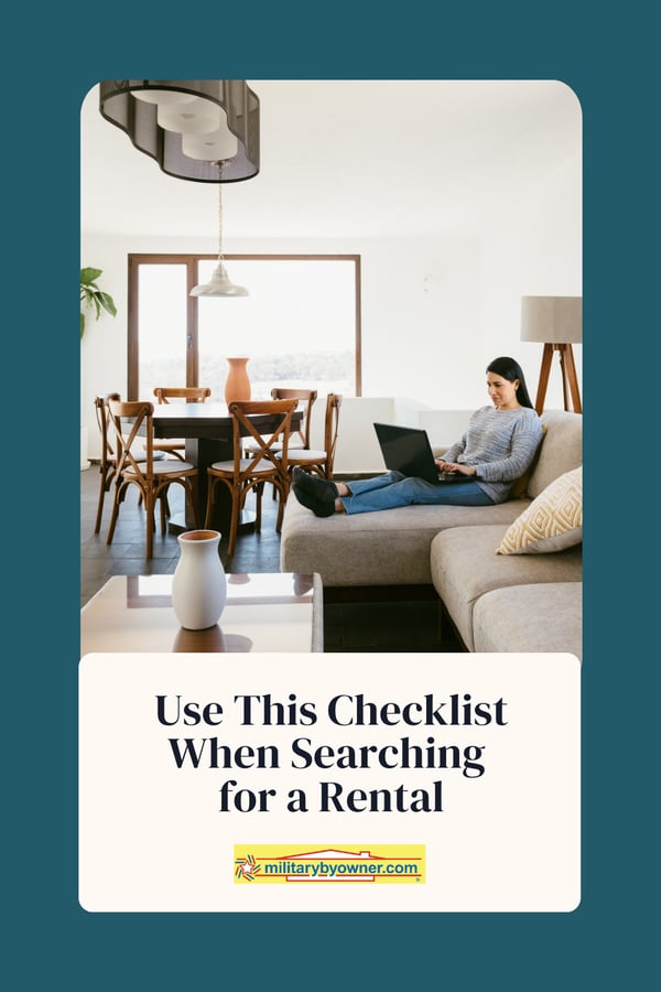 Woman in gray sweater sitting on couch with legs up typing on computer in lap with text, Use This Checklist When Searching for a Rental