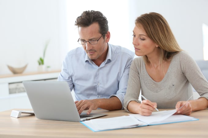 Couple at home working on laptop computer-1