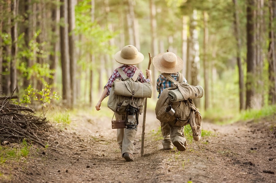 two children walking on nature trail