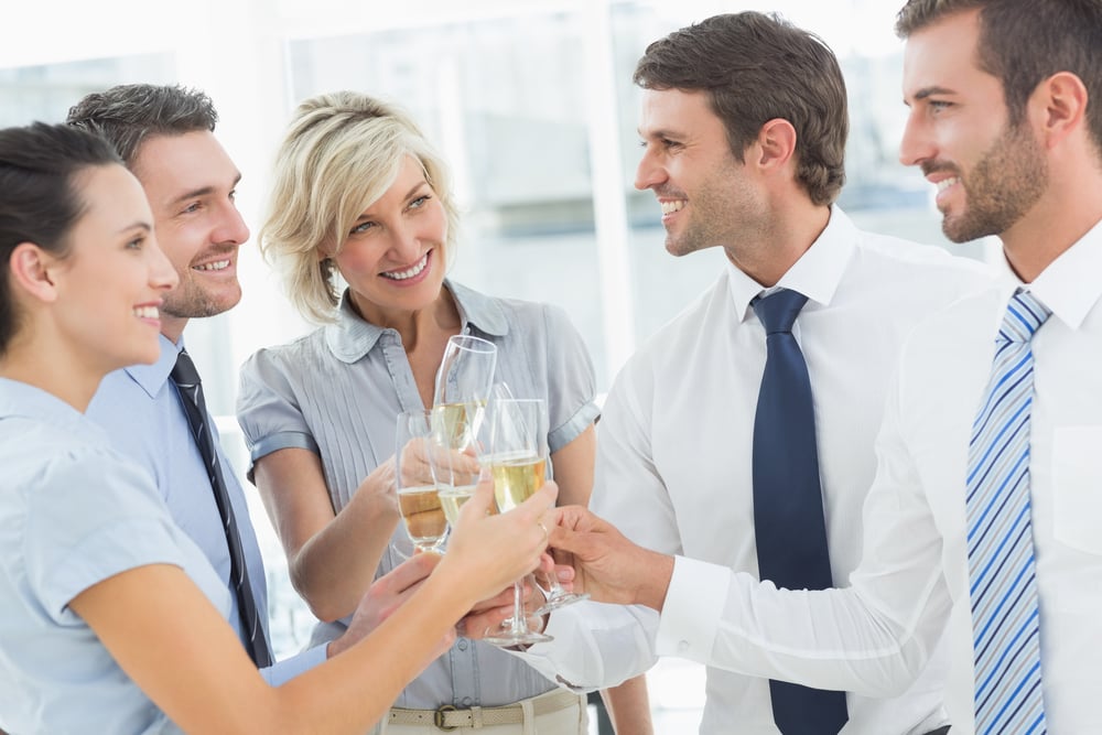Group of happy business team toasting with champagne in the office-1