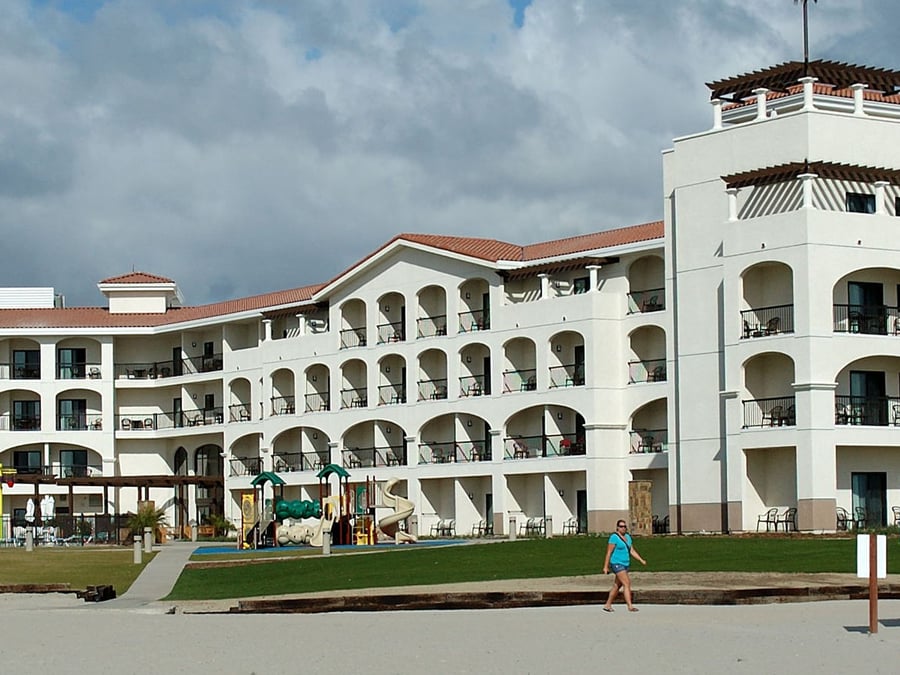 woman walking past North Island lodging Exterior