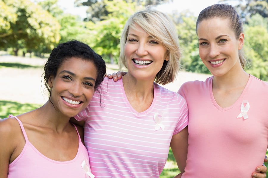 women volunteers in pink shirts