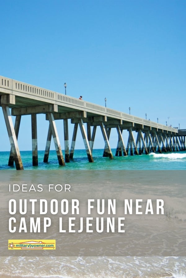 Photo of pier in blue-green water on the coast of North Carolina with text, Ideas for Outdoor Fun near Camp Lejeune