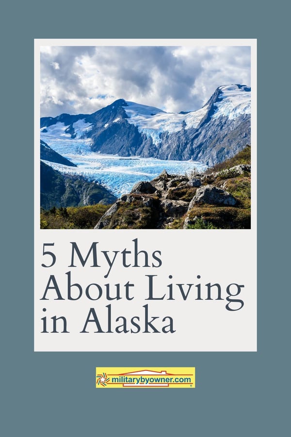 View of Alaskan mountains surrounding icy water with text, 5 Myths About Living in Alaska