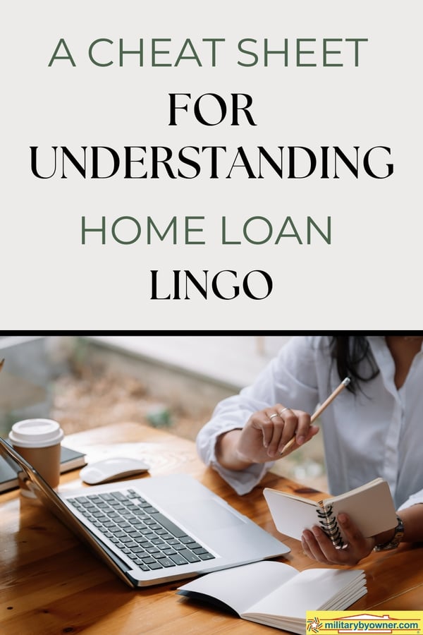 Woman wearing a button-down sits at wooden table with coffee cup, and a laptop holds small notebook and pencil in hand with text, A Cheat Sheet for Understanding Home Loan Lingo