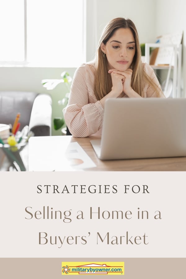 Woman sitting in front of computer with her hands crossed under her chin and text, Strategies for Selling a Home in a Buyers Market